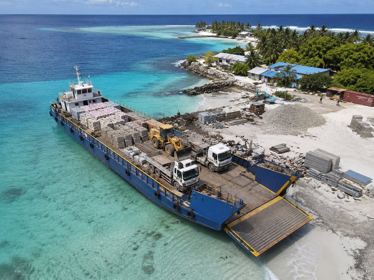 Landing craft delivering construction materials to a Maldives island